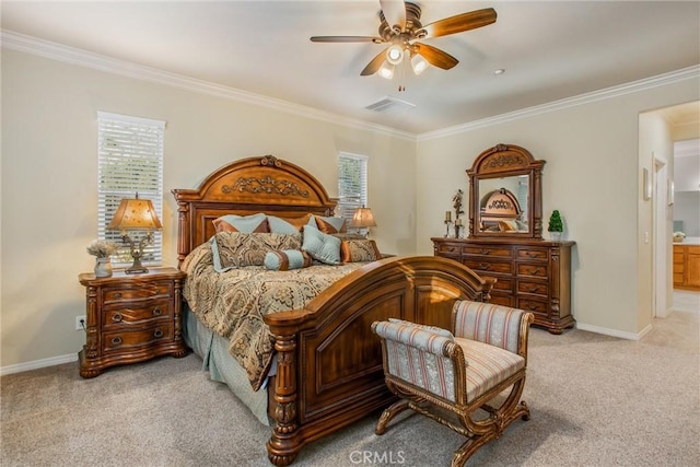 carpeted bedroom with ceiling fan and crown molding