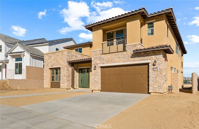 mediterranean / spanish home with a garage