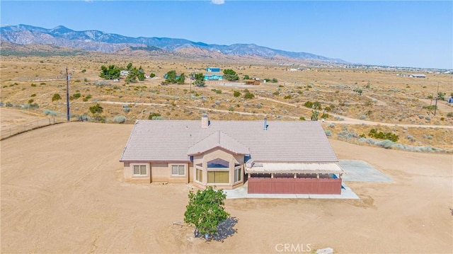 drone / aerial view featuring a mountain view