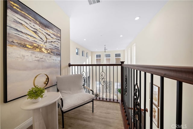 corridor with light hardwood / wood-style floors