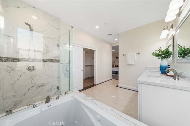 bathroom with tile patterned flooring, vanity, and shower with separate bathtub