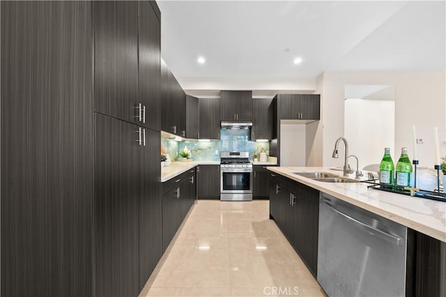 kitchen featuring light tile patterned floors, backsplash, stainless steel appliances, and sink