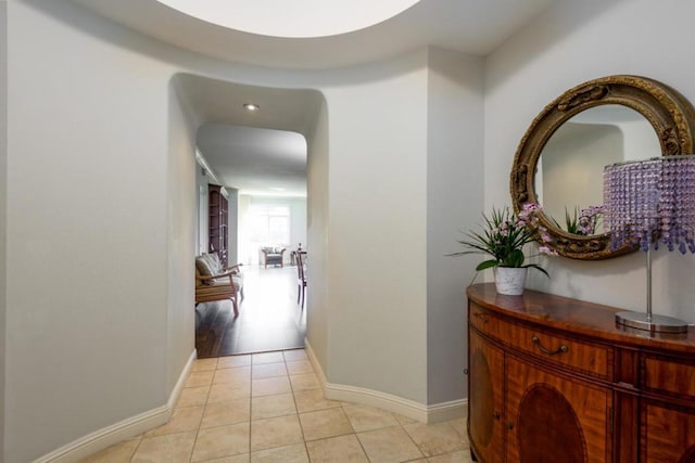 corridor featuring light tile patterned floors