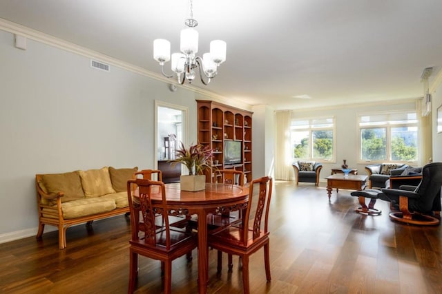 dining space with ornamental molding, dark hardwood / wood-style flooring, and a notable chandelier