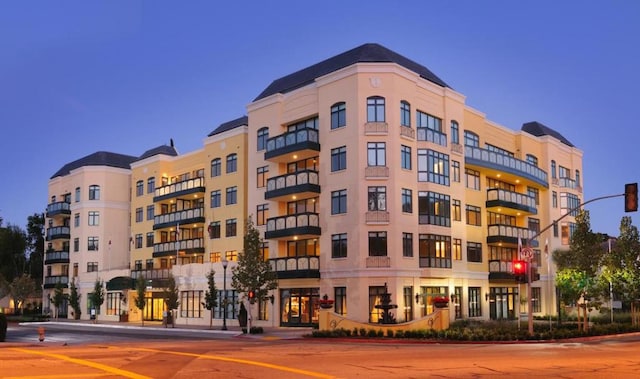 view of outdoor building at dusk