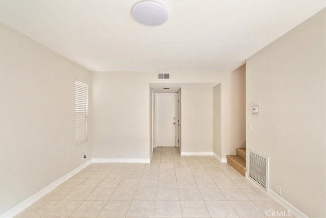 unfurnished room with light tile patterned floors