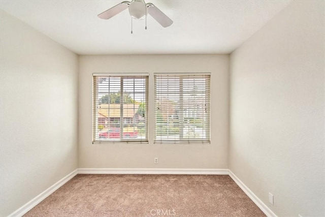 carpeted empty room with ceiling fan