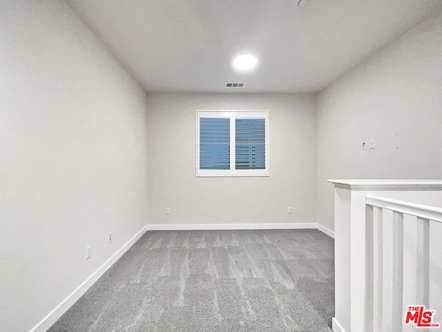 unfurnished room with carpet floors