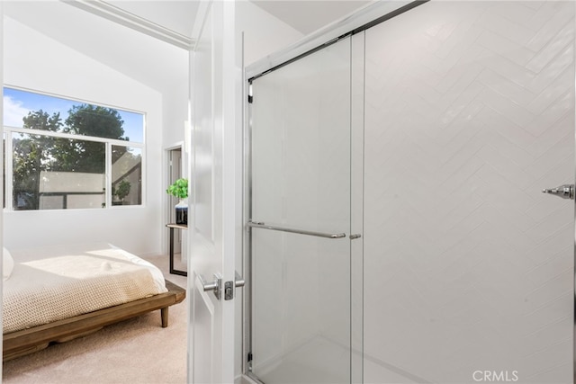 bathroom with walk in shower and vaulted ceiling