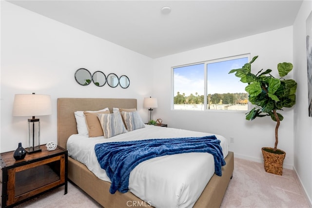 bedroom featuring light carpet