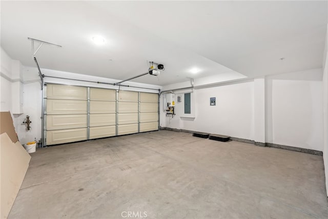 garage featuring electric panel and a garage door opener