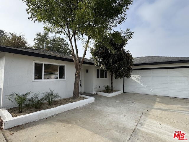 ranch-style home with a garage