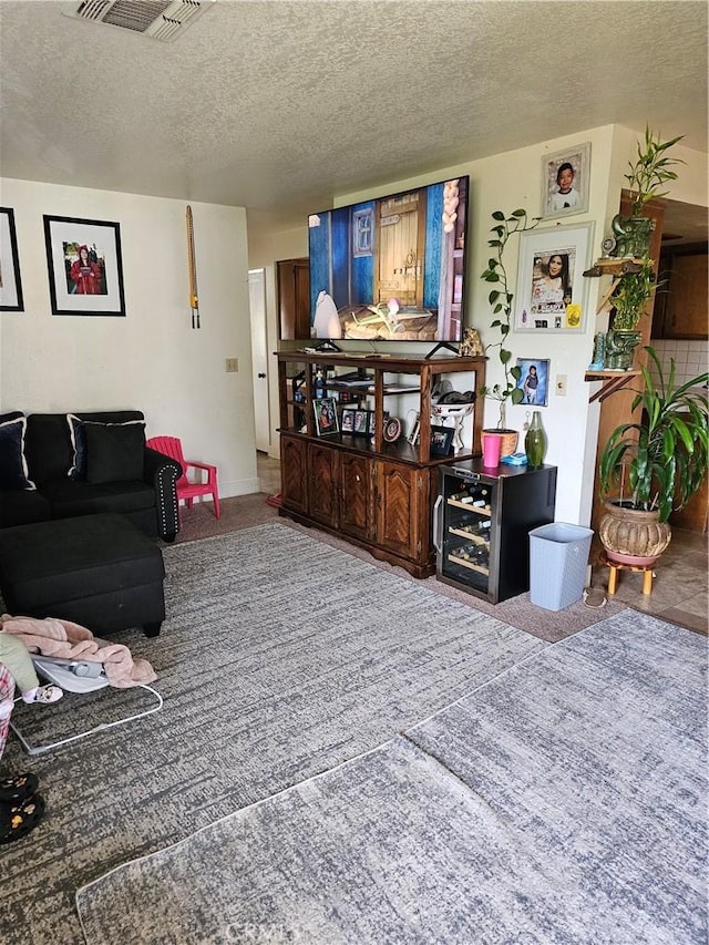 living room with a textured ceiling