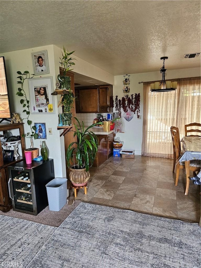 dining area with a textured ceiling