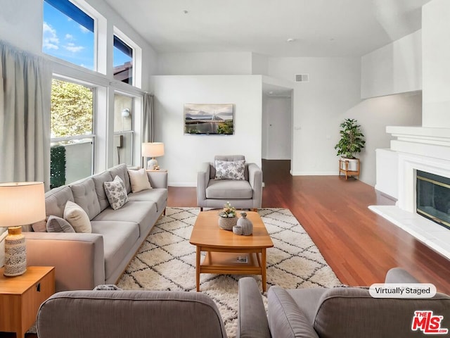 living room with light hardwood / wood-style flooring