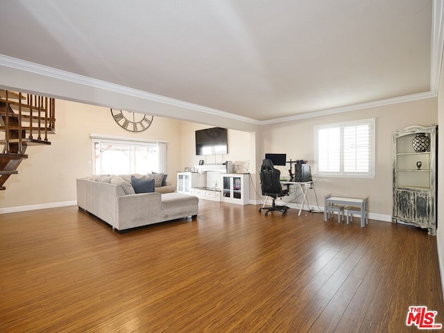 living room with wood-type flooring and ornamental molding