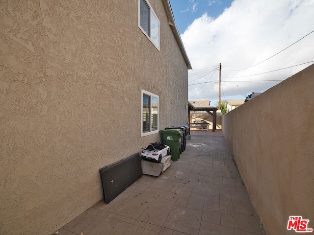 view of side of property with a patio