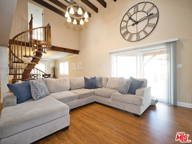 living room featuring beam ceiling, high vaulted ceiling, a chandelier, and hardwood / wood-style flooring