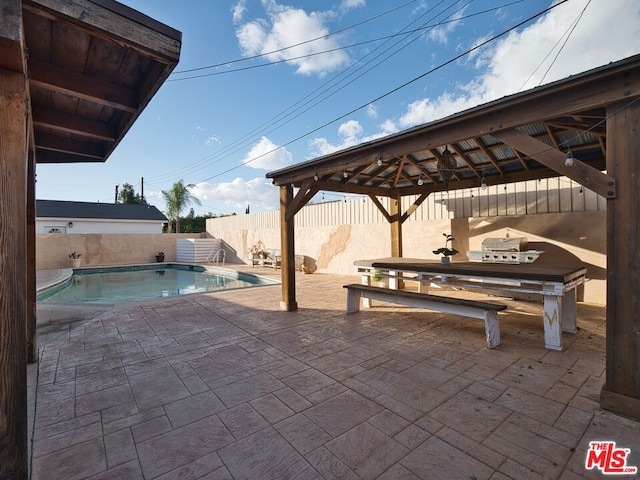 view of swimming pool with a gazebo and a patio