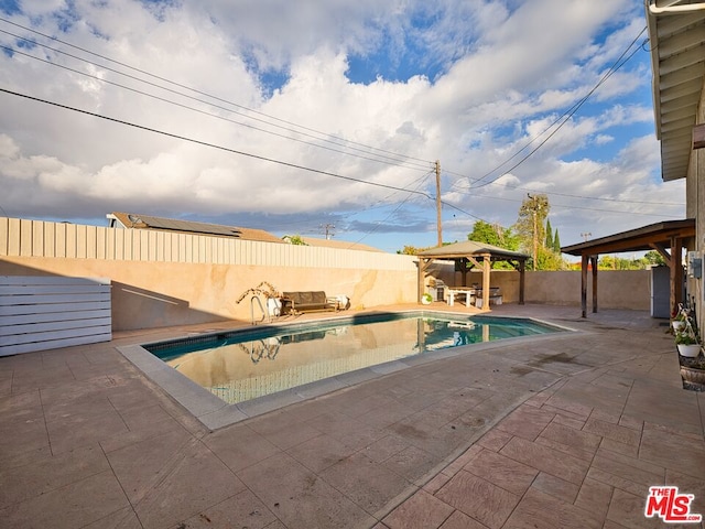 view of pool with a gazebo and a patio area