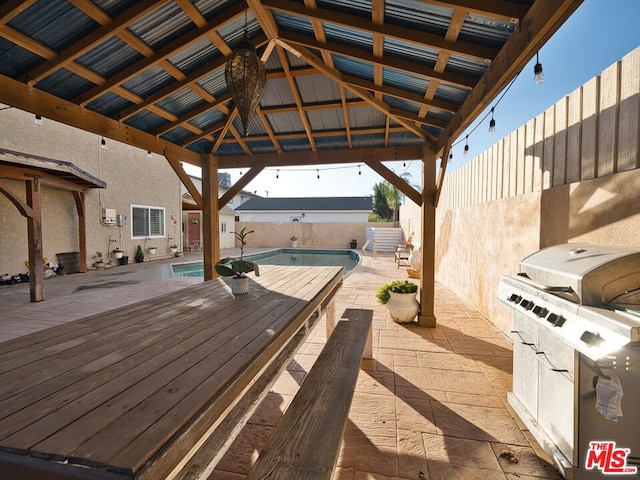 view of patio with a gazebo and a pool side deck