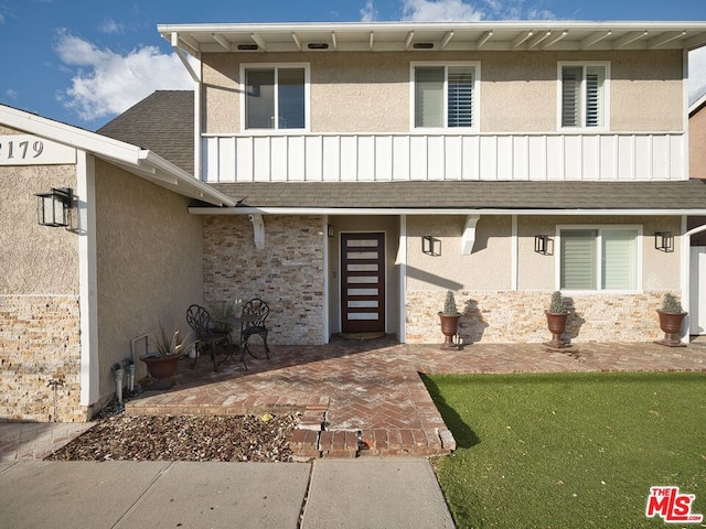 view of front of house with a patio area