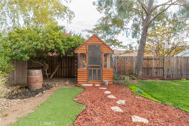 view of outdoor structure featuring a yard