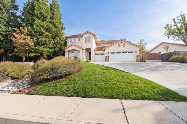 view of front of house featuring a front yard and a garage