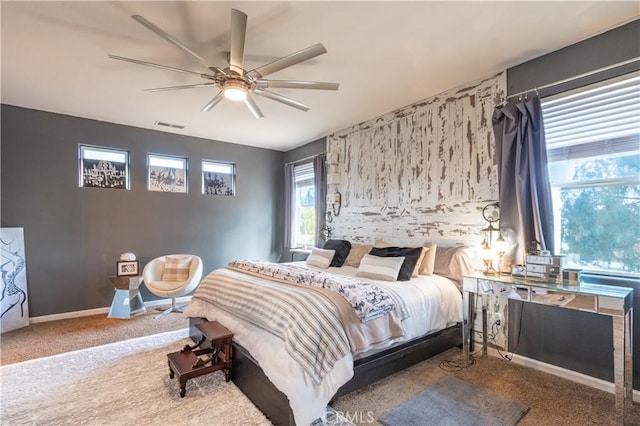 bedroom with ceiling fan and carpet