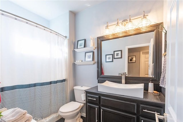 bathroom with toilet and vanity