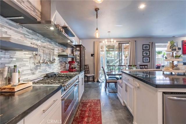 kitchen featuring white cabinetry, decorative backsplash, decorative light fixtures, and range with two ovens