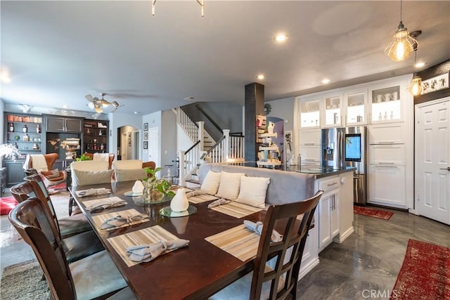 dining space featuring ceiling fan