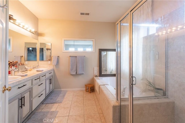 bathroom featuring tile patterned floors, vanity, and independent shower and bath