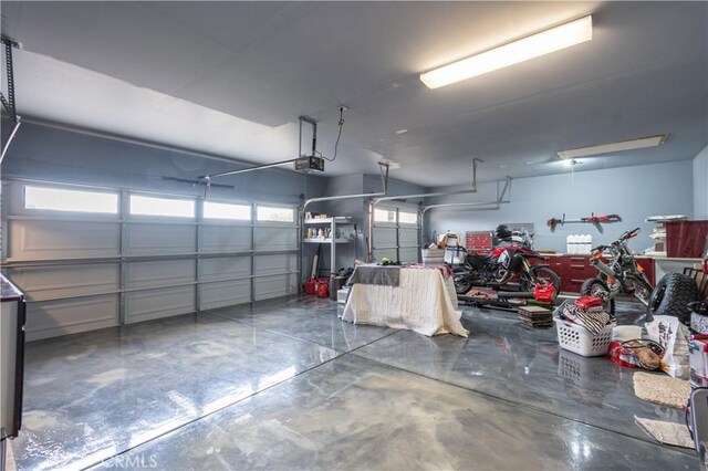 garage featuring a garage door opener