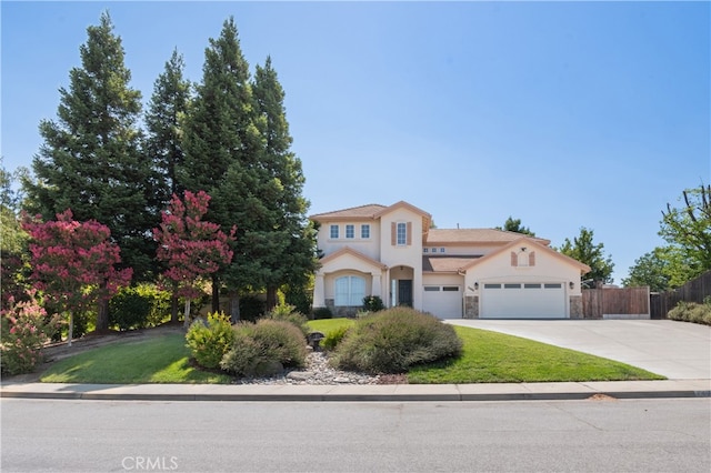 view of front of property with a front lawn and a garage