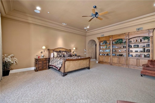 carpeted bedroom featuring ceiling fan and ornamental molding