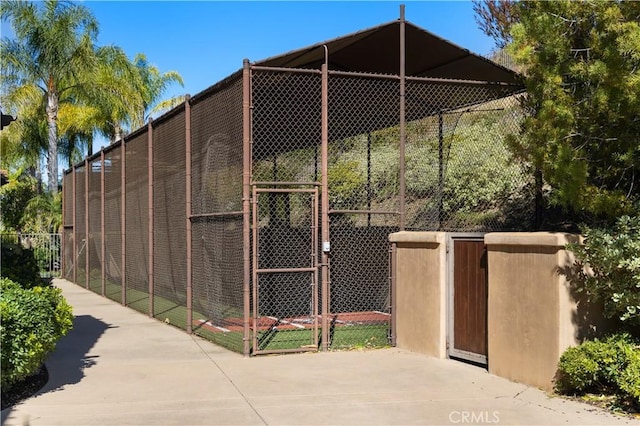 view of outbuilding with fence