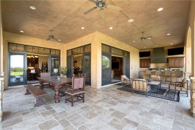 view of patio / terrace with outdoor dining area and a ceiling fan