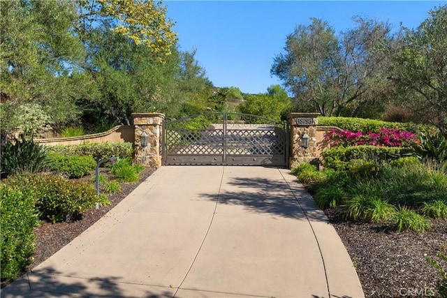 view of gate with fence
