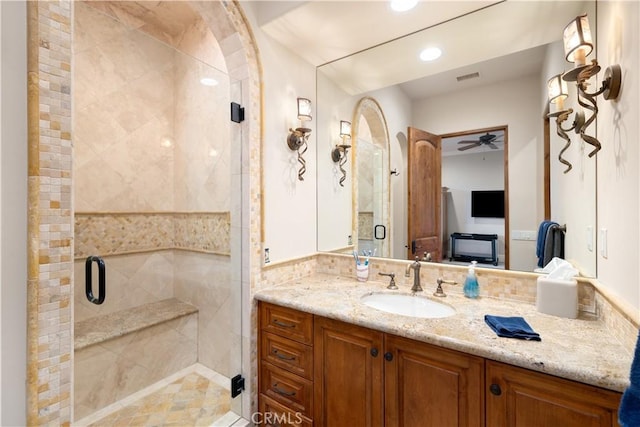 full bathroom featuring a ceiling fan, a stall shower, vanity, visible vents, and recessed lighting