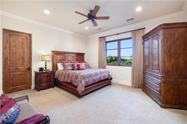 carpeted bedroom featuring ceiling fan and ornamental molding