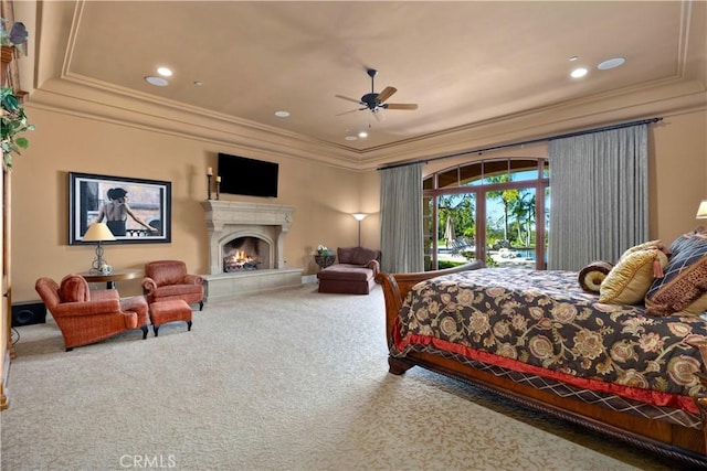 carpeted bedroom with a fireplace, crown molding, access to outside, and recessed lighting