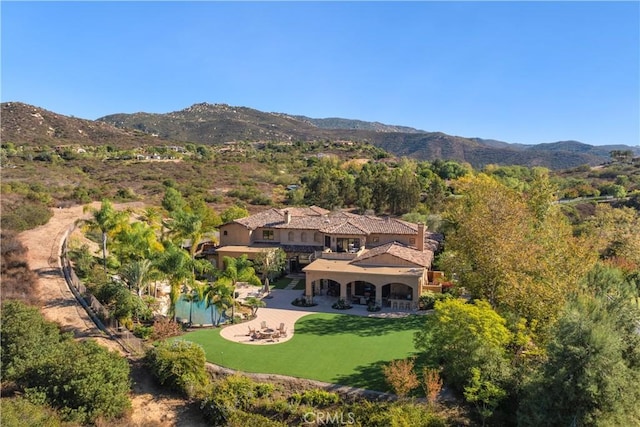 birds eye view of property featuring a mountain view