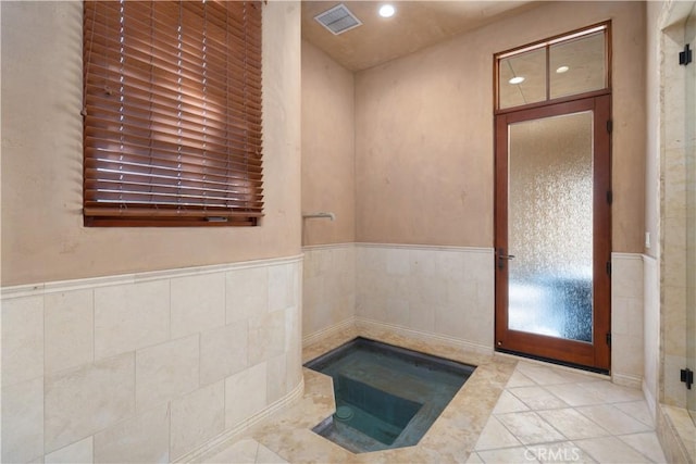 bathroom with recessed lighting, visible vents, tile patterned floors, and wainscoting