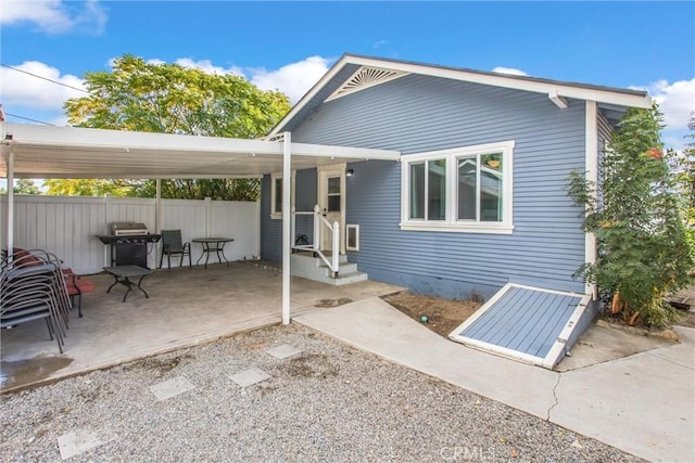 rear view of house featuring a patio