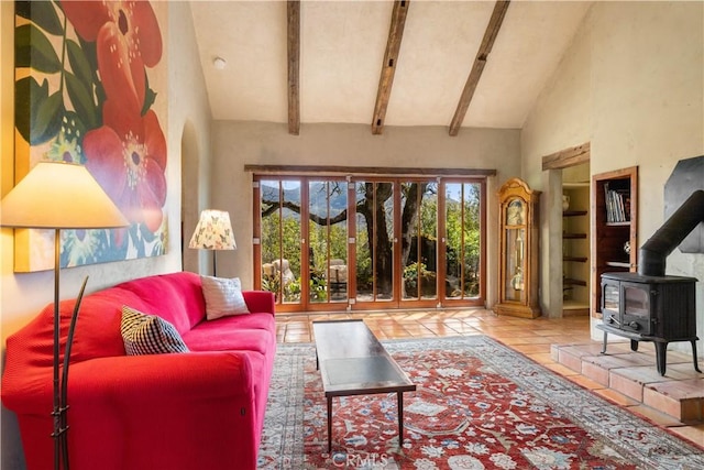 living room with beam ceiling, light tile patterned floors, high vaulted ceiling, and a wood stove