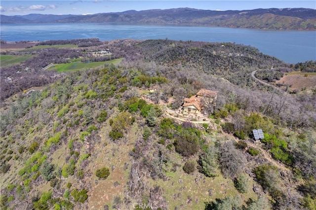 bird's eye view with a water and mountain view