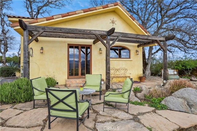 rear view of house featuring a patio area