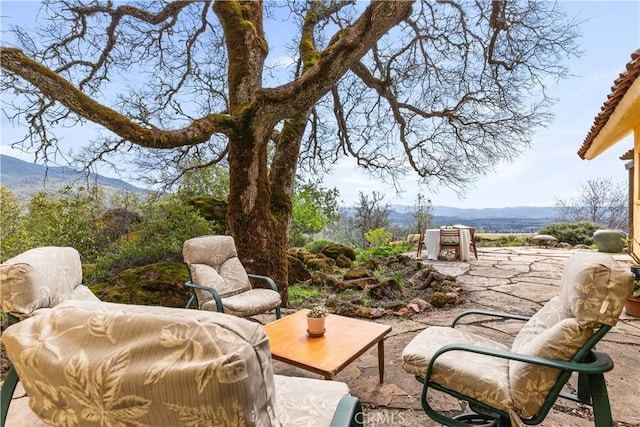 view of patio / terrace featuring a mountain view