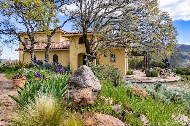 mediterranean / spanish home featuring a mountain view